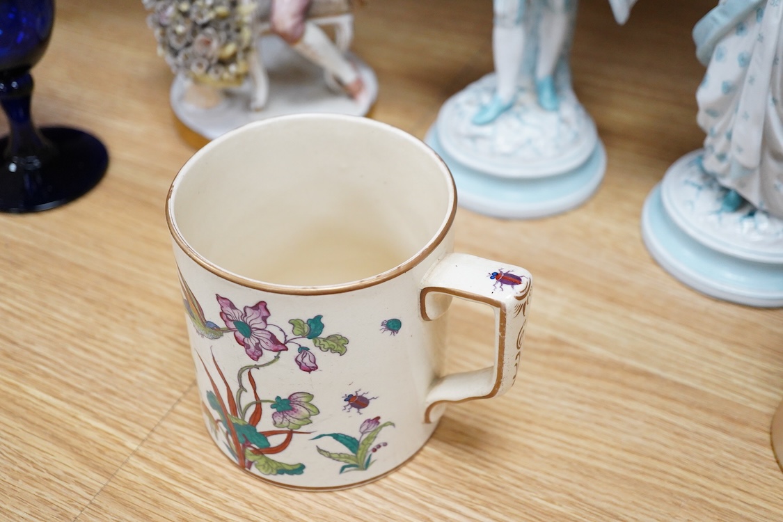 Sundry porcelain comprising three German figures, a Royal Worcester blush ivory ewer and a mug, together with a blue wine glass, largest 26cm high